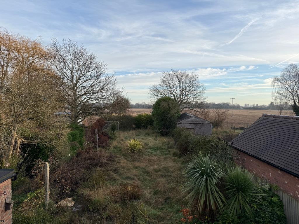 Lot: 163 - SEMI-DETACHED HOUSE FOR IMPROVEMENT - View to the rear of the property towards farmland